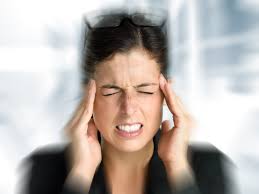 Woman feeling dizzy holding head vertigo issue